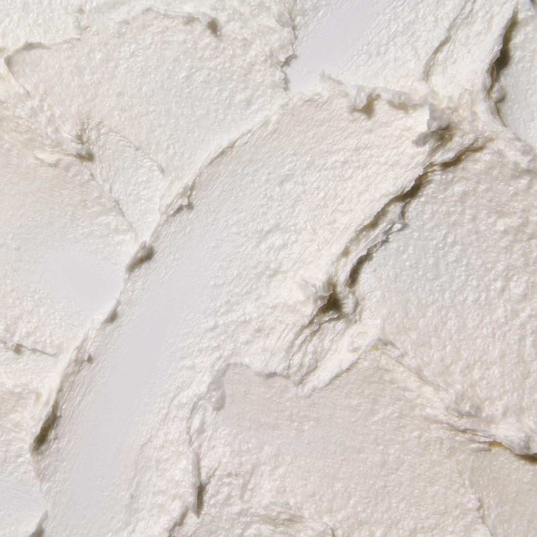 A dense, freshly whipped shave lather, close up