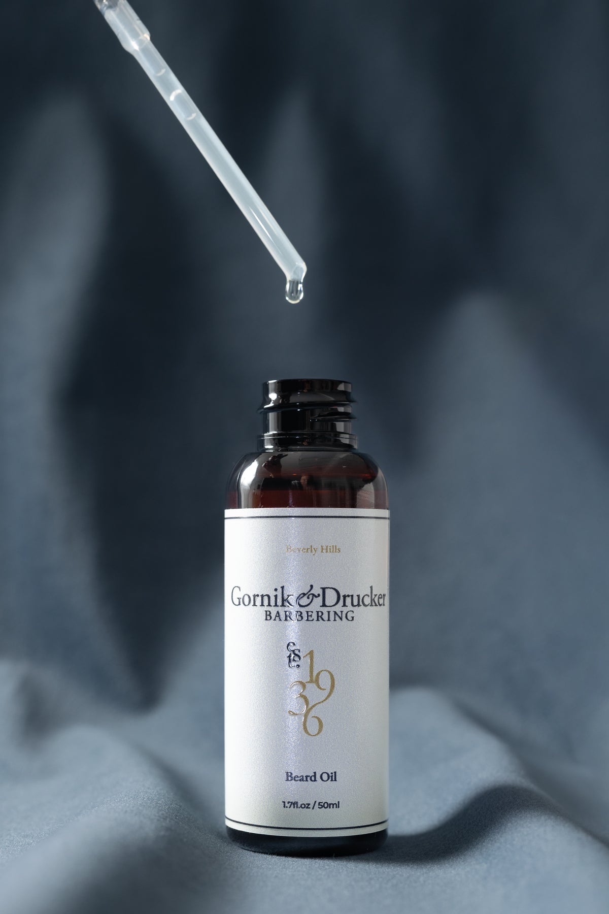 Beard Oil dropper drawn above the open bottle
