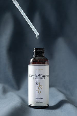 Beard Oil dropper drawn above the open bottle