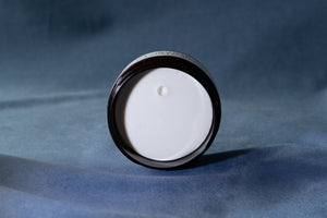 The texture of Dry Matte Clay in the open jar