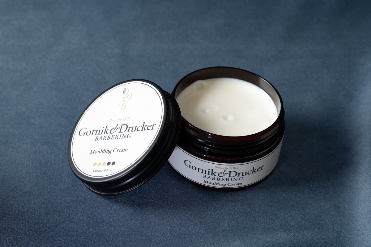 Moulding Cream jar open beside its lid