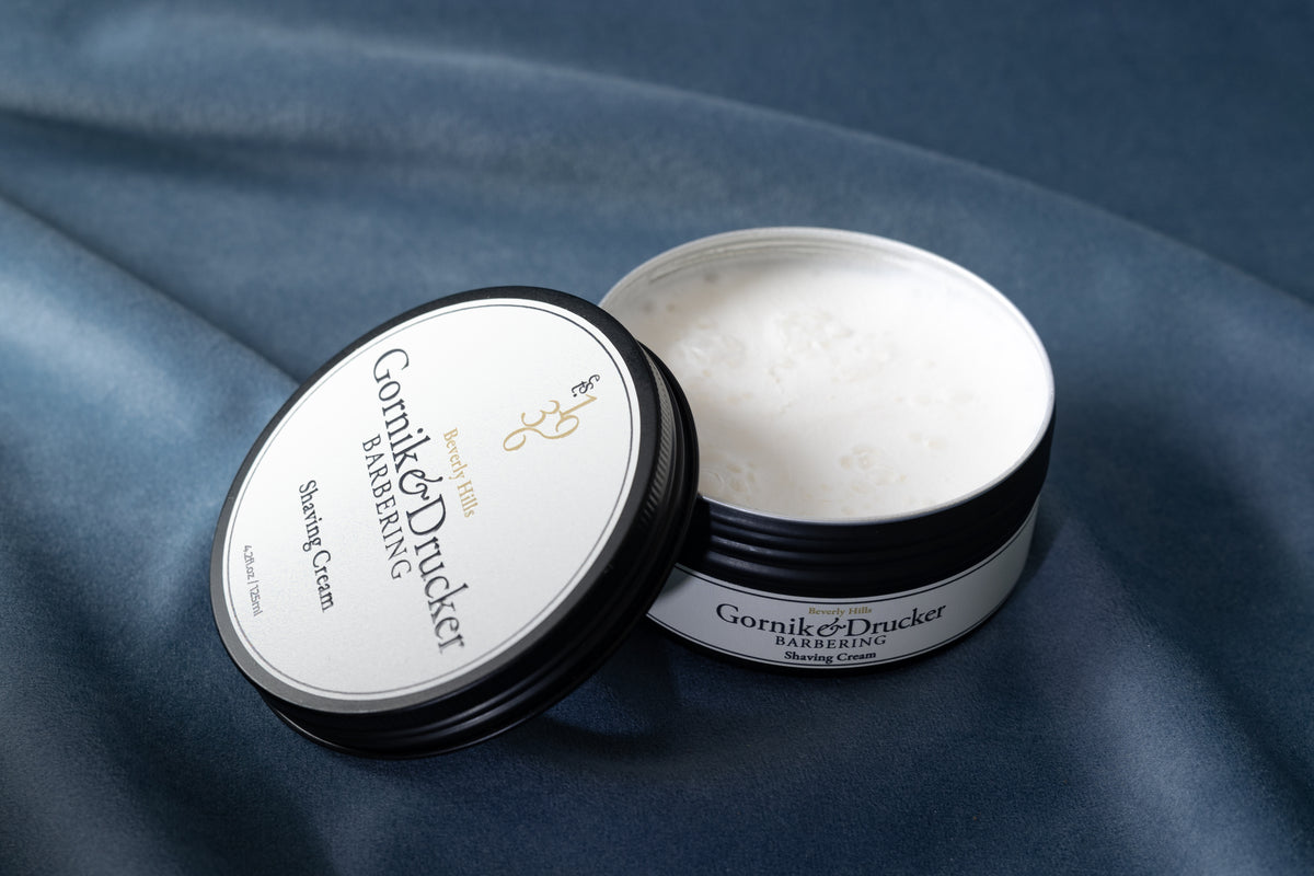 Shaving Cream jar open beside its lid