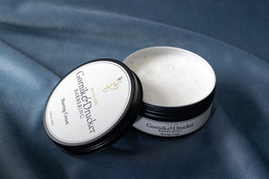 Shaving Cream jar open beside its lid
