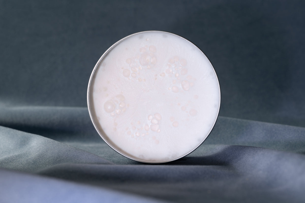 The soft texture of Shaving Cream in the open jar