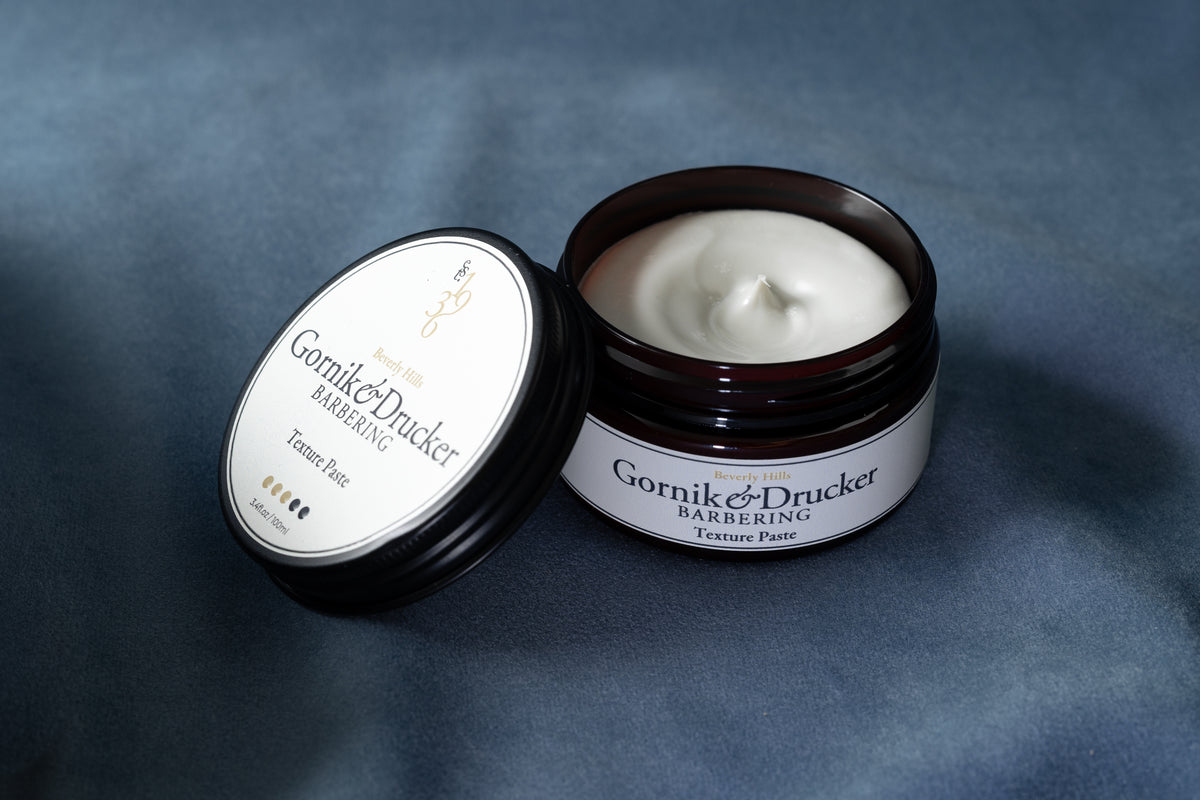 Texture Paste jar open beside its lid
